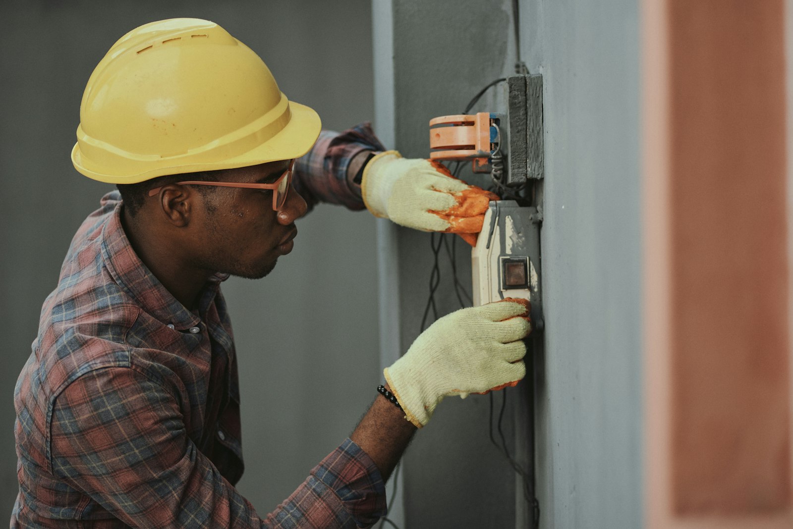 A BANEC electrician working through an installation on site.