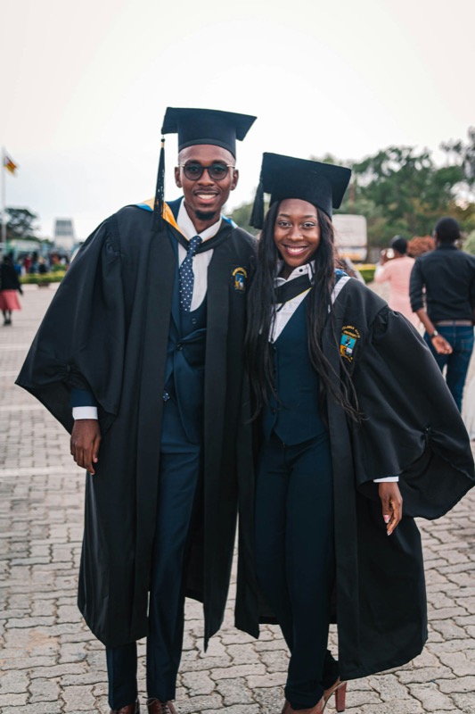 A young Ugandan engineer in academic gown after graduation.